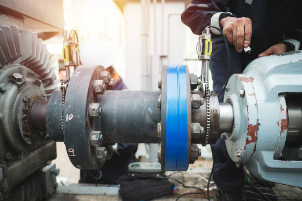 Maintenance Technician inspector alignment pump  and electric motor, Repairing work in factory concept coupling stock pictures, royalty-free photos & images