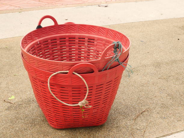 istock red plastic basket in the garden 1166637791