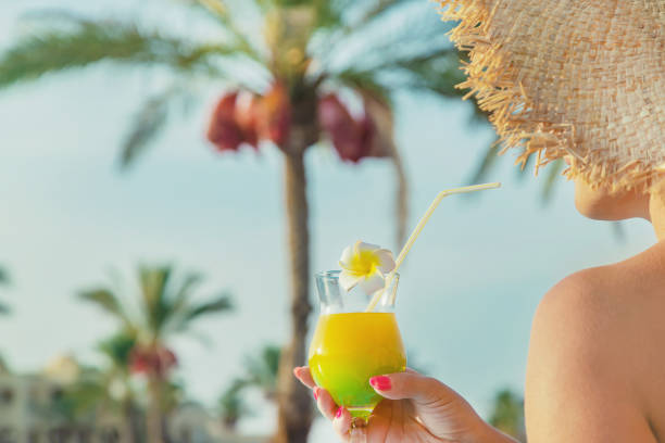 istock cocktail in the hands of a woman. Selective focus. 1166638345