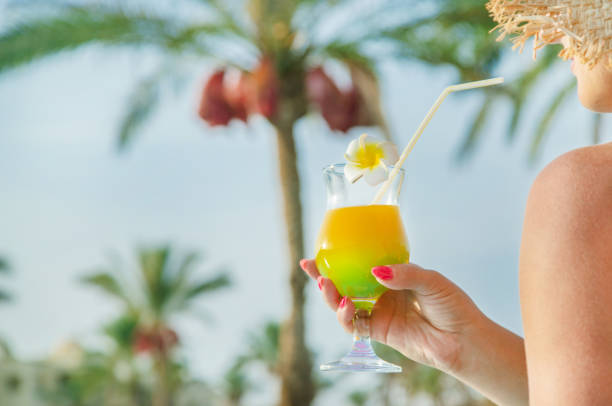 istock cocktail in the hands of a woman. Selective focus. 1166638346