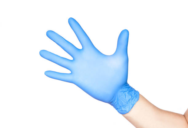 istock Doctor hand in gloves isolated on white 1166640547