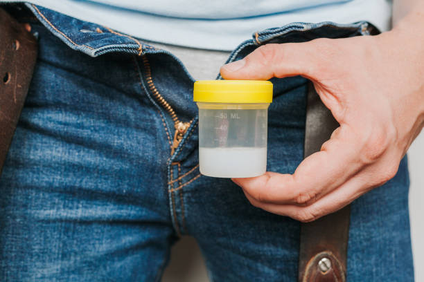 Man Holding in Hands Container With Sperm Man Holding in Hands Container With Sperm. Sperm donor. Health concept sperm test stock pictures, royalty-free photos & images