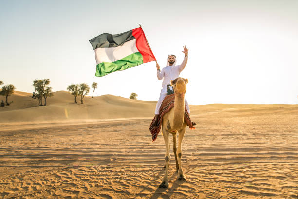 istock Arabian man with camel in the desert 1166641686