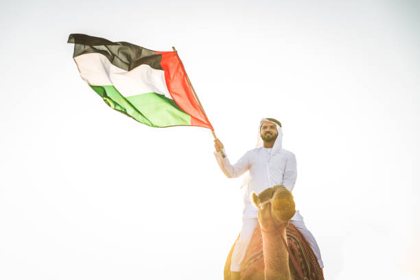 istock Arabian man with camel in the desert 1166641989