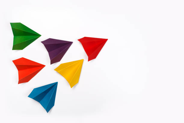 istock Color paper airplanes on white background. top view 1166643345