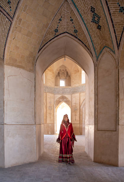 istock beautiful young iranian lady in a mosque 1166646803