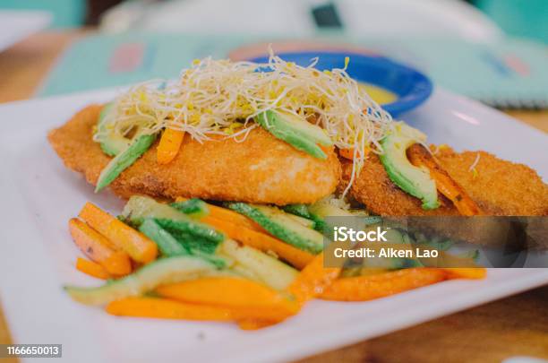 Fried Fish With Vegetables Stock Photo - Download Image Now - Close-up, Cooked, Cooking