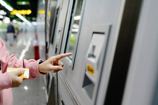 istock Woman choosing the destination on subway train ticket machine. Transportation concept 1166650966