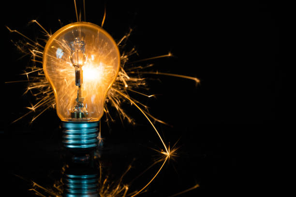 istock light bulb and sparkler in the dark 1166651052