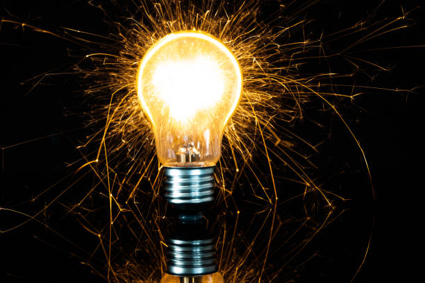 istock light bulb and sparkler in the dark 1166651075