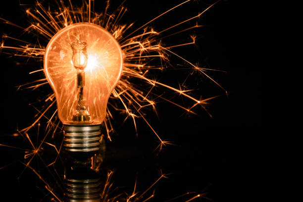 istock light bulb and sparkler in the dark 1166651125