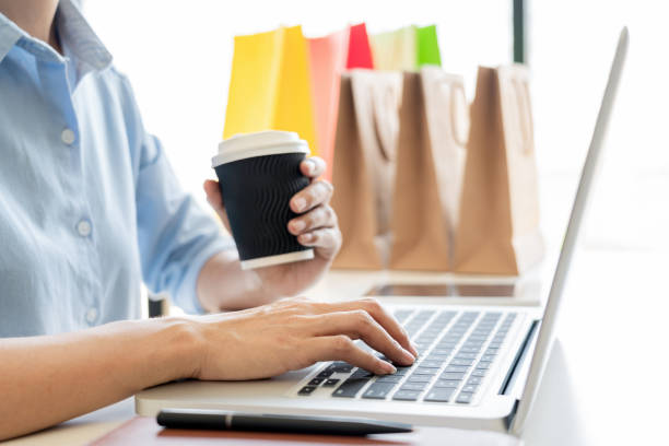 istock Midsection Of Woman Using Laptop While Sitting At Table 1166651749