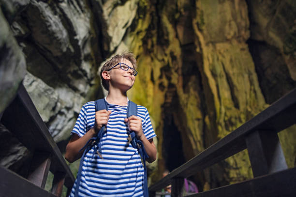 istock Little boy exploring caves in Campania, Italy 1166655900