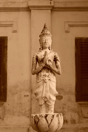 This is a statue inside a temple complex in Luang Prabang, Lao.