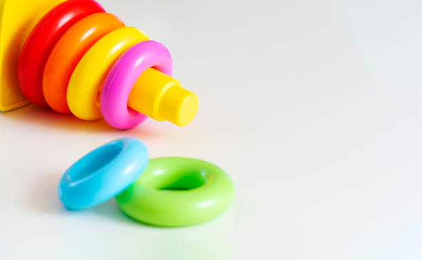 istock Plastic rings of various colors are stacked in a yellow plastic tower. 1166659122