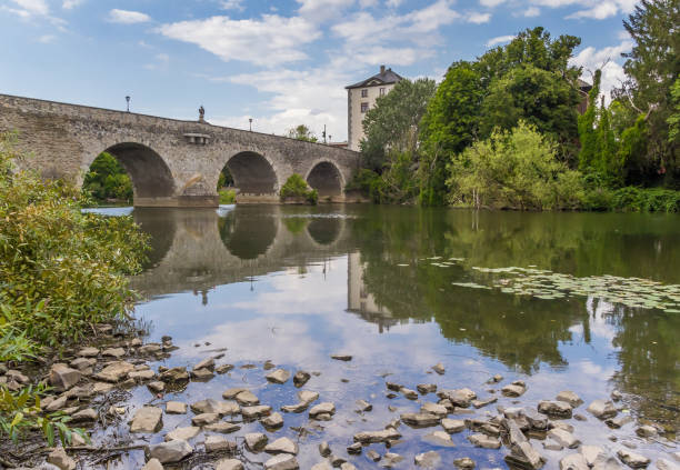 istock Old stone bridge over the Lahn river in Limburg 1166660663