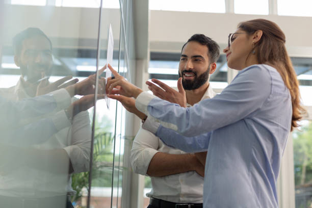 istock Pleased young people discussing their new startup 1166663007