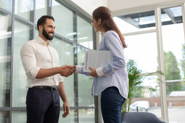 istock Joyful bearded man standing in front of his colleague 1166663169