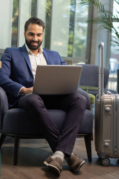 istock Cheerful office worker communicating online with partner 1166663397