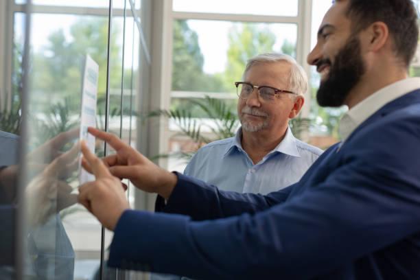 istock Positive delighted males discussing their new project 1166663529