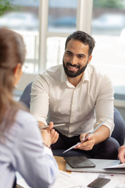 istock Handsome bearded male person presenting his idea 1166663643
