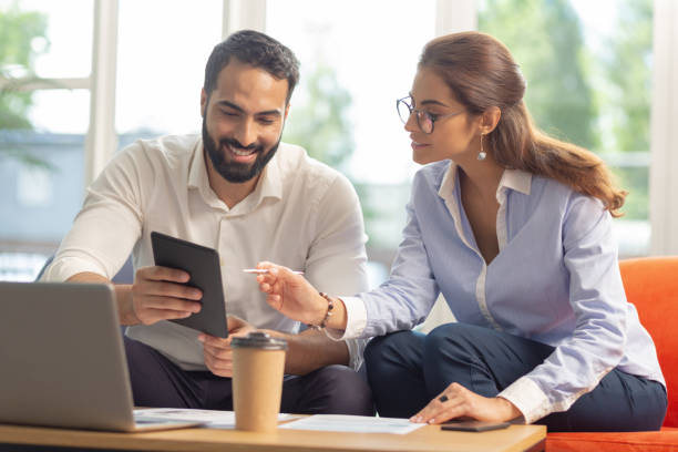 istock Delighted young people looking at screen of tablet 1166663645