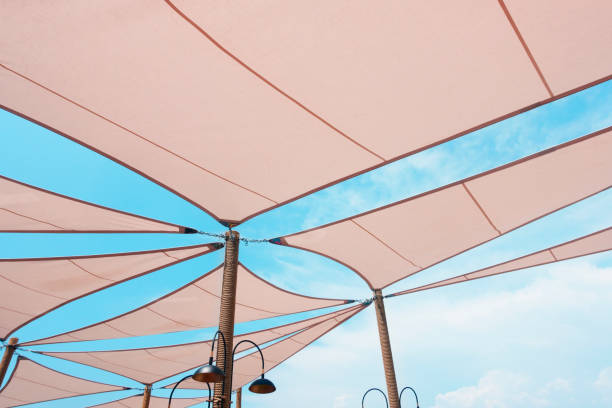 sonnensegel - shade sail awning textile stock-fotos und bilder