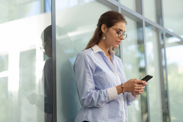 istock Attentive female person typing message to her partner 1166663792