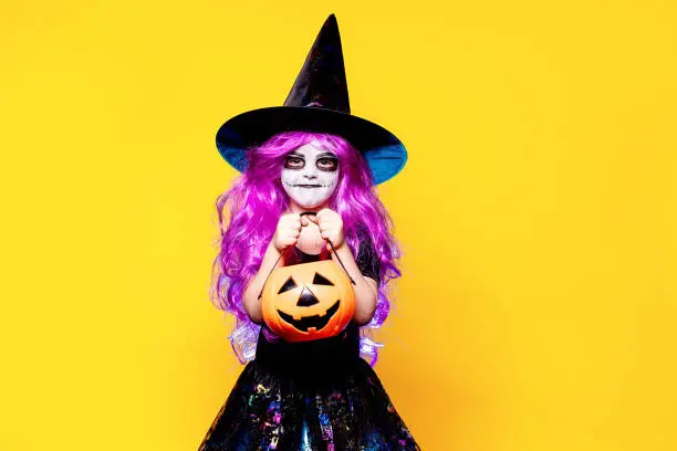Photo of Girl in witch Halloween costume