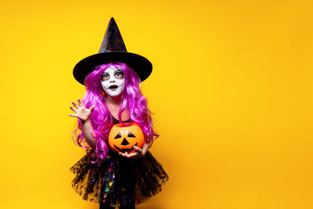 istock Girl in witch Halloween costume 1166663850