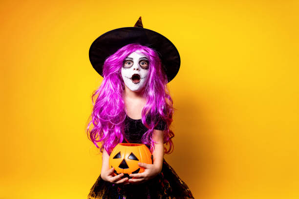 istock Girl in witch Halloween costume 1166664444