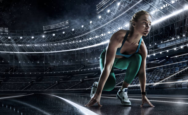 Sports background. Runner on the start line of the glowing stadium . Futuristic running track. Dramatic picture. Sport backgrounds sprinting photos stock pictures, royalty-free photos & images