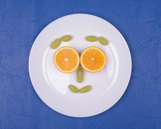 istock installation of grapes and orange slices 1166665762