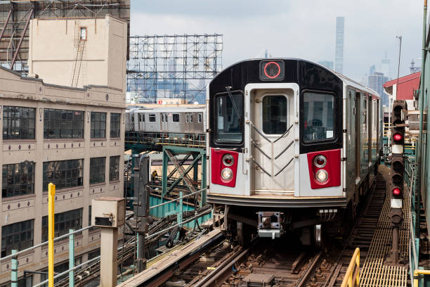 istock Public Transportation, Subway Train Speeding on Elevated Track in Queens, New York 1166667090