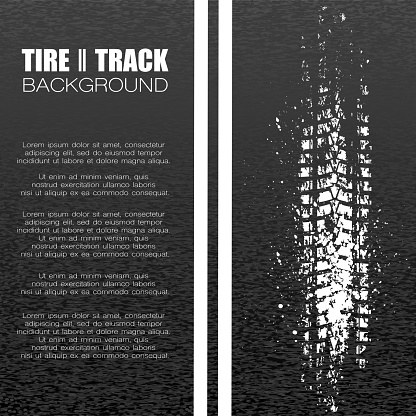 Black asphalt background with white tire track and text