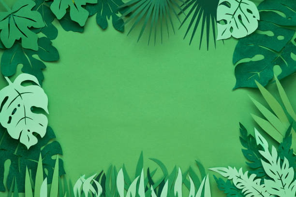 istock Dark floral background with paper tropical leaves 1166669832