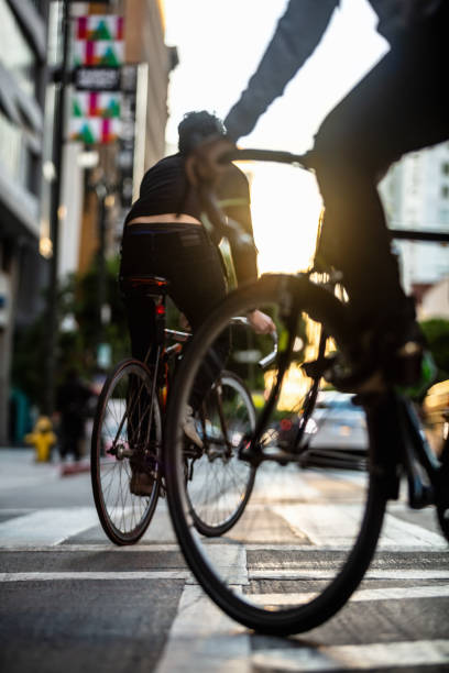 istock Cyclists Turning Into Bike Lane 1166670871