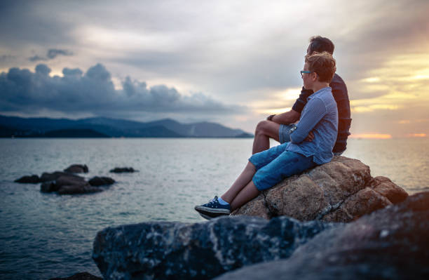 istock Father and son watching sunset at sea. Ko Samui. Thailand 1166671051