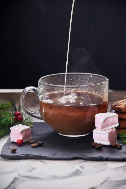 istock Coffee with milk preparation in glass cup with marshmallow 1166671272