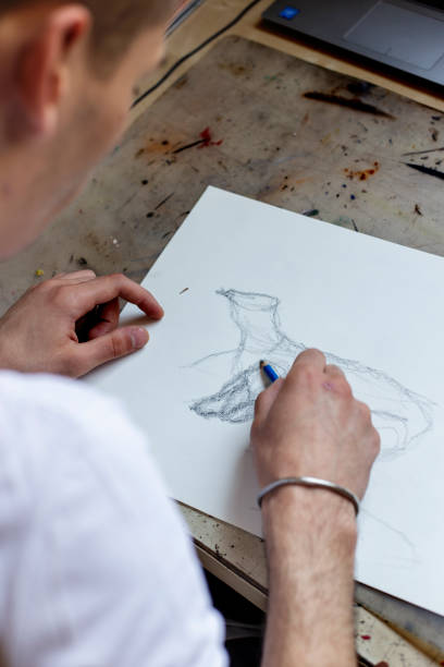 istock Young Male Artist Working On Painting 1166673311