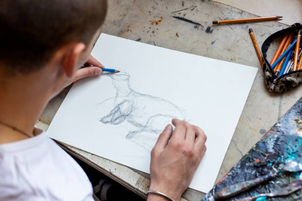 istock Young Male Artist Working On Painting 1166673337