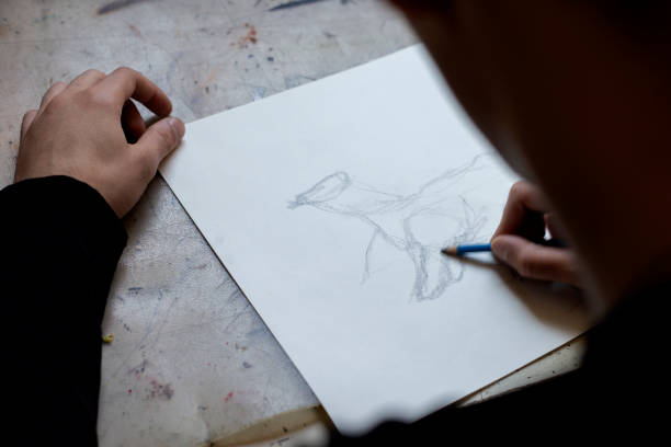 istock Young Male Artist Working On Painting 1166673367