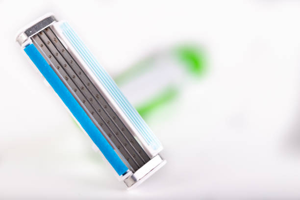 istock Male razor on a white table. Personal hygiene accessories. Light background. 1166674372