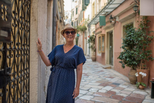 istock Woman walking in old town 1166675979