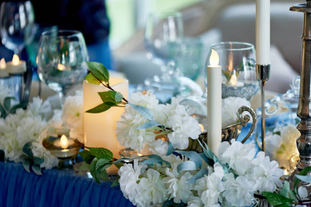 istock Wedding table decorated with white flowers, candles.. Blue and white 1166677123