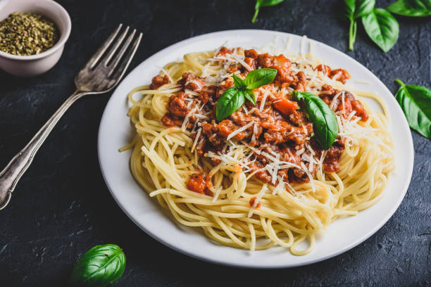 istock Spaghetti with bolognese sauce and parmesan cheese 1166681457