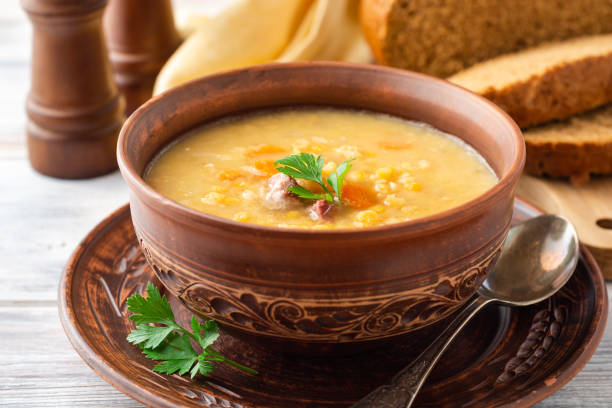 istock Split pea soup in ceramic bowl on wooden table 1166681771