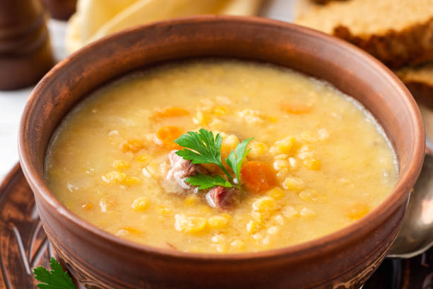 istock Split pea soup in ceramic bowl on wooden table 1166681773