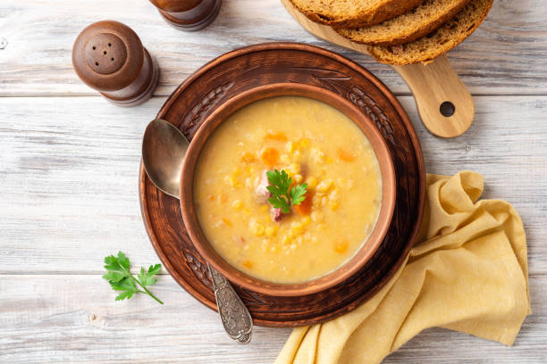 istock Split pea soup in ceramic bowl on wooden table 1166681774