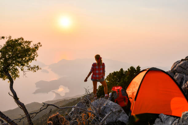 istock Woman in tent camp. 1166682509